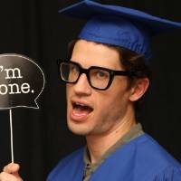 student uses 'im done' prop at GradFest photo booth